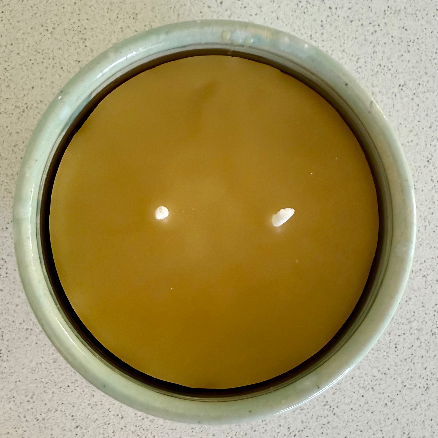 “Sea Foam” pure beeswax candle in local pottery