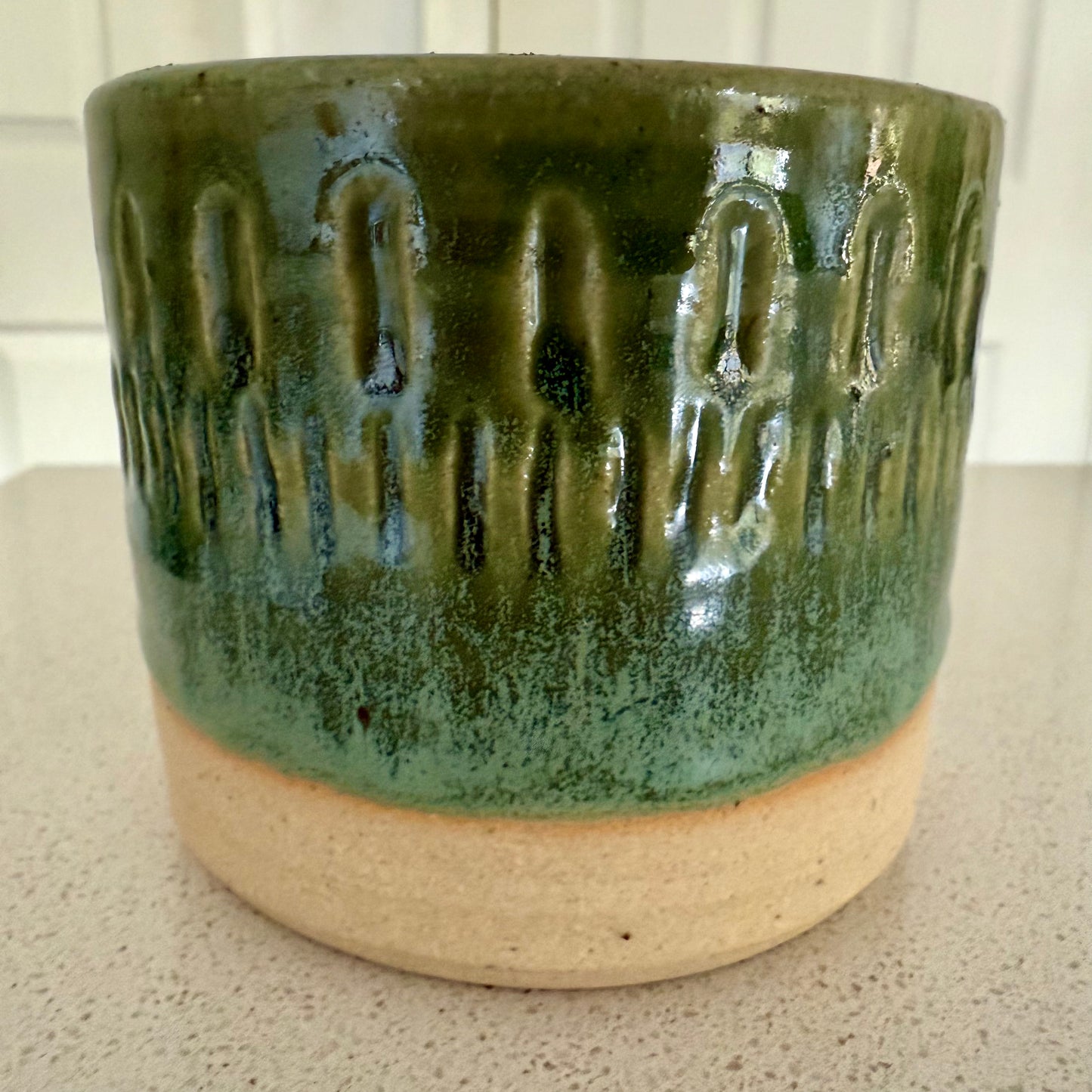 “Emerald Ember” pure beeswax candle in local pottery