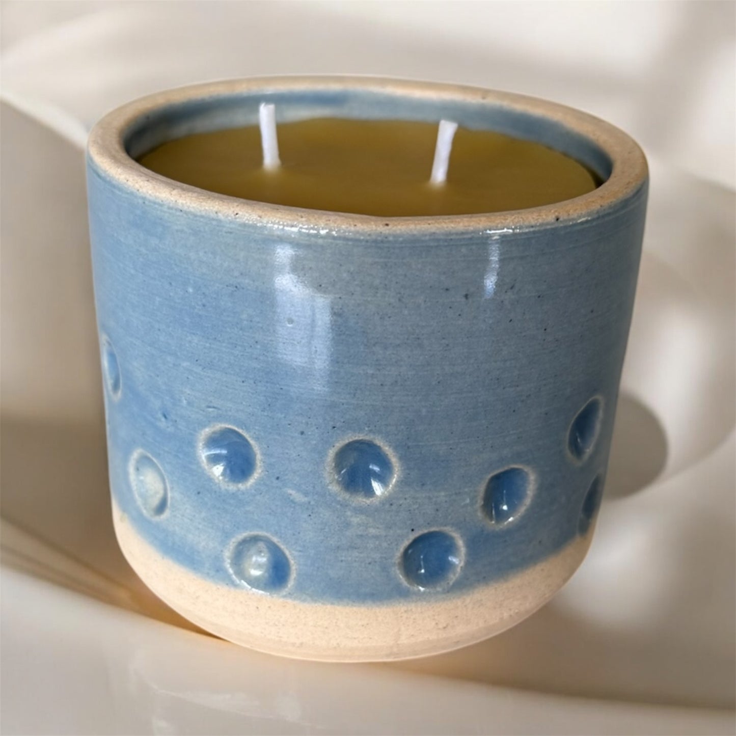“Spotty Bleu” pure beeswax candle in local pottery